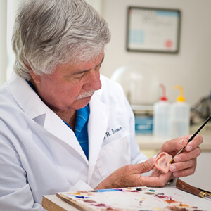 Robert Barron working on a prosthetic ear