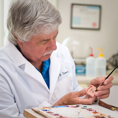 Robert Barron working on a prosthetic ear